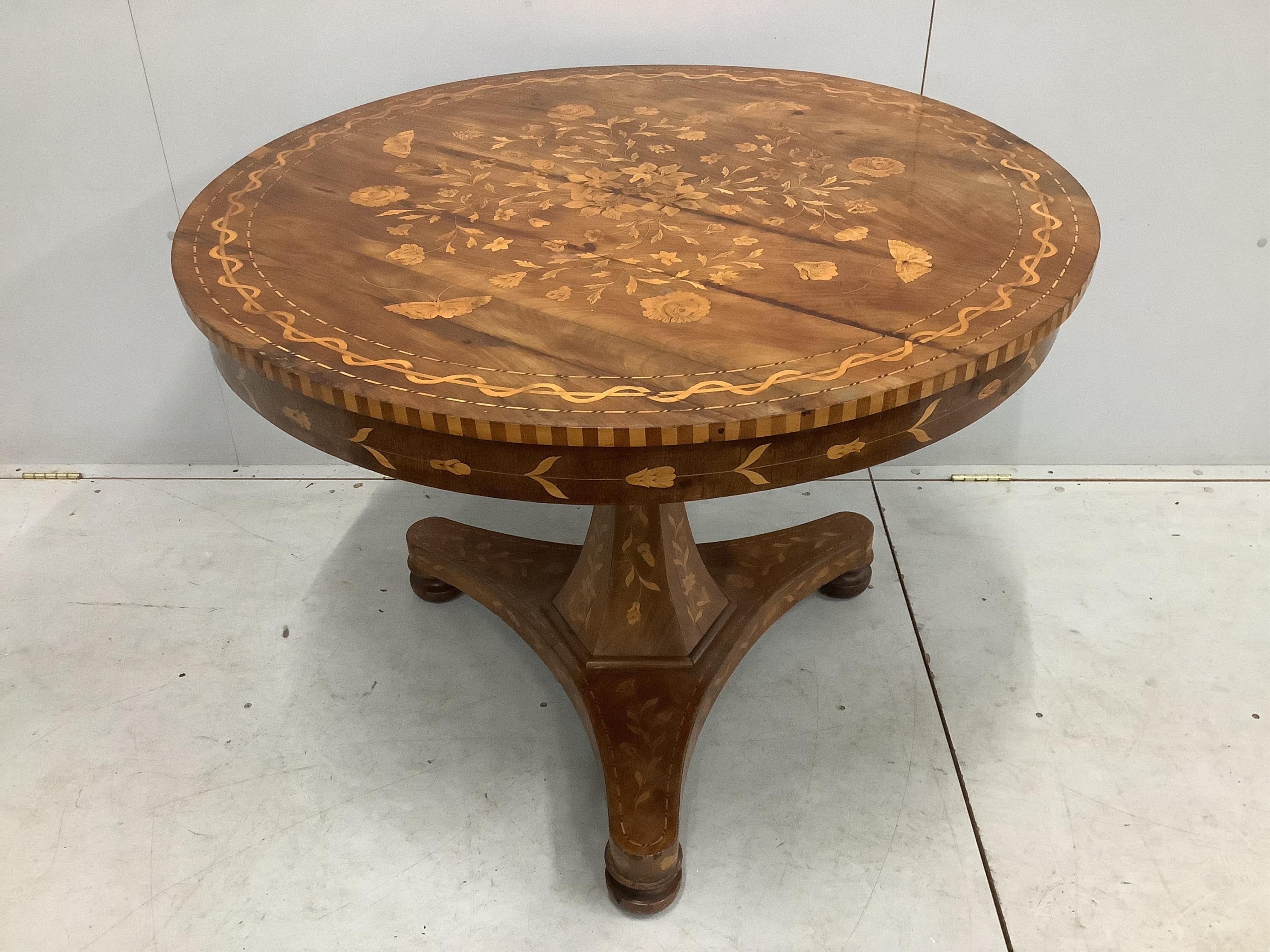 An early 19th century Dutch marquetry inlaid circular walnut centre table, diameter 100cm, height 77cm. Condition - fair, top has several veneer splits